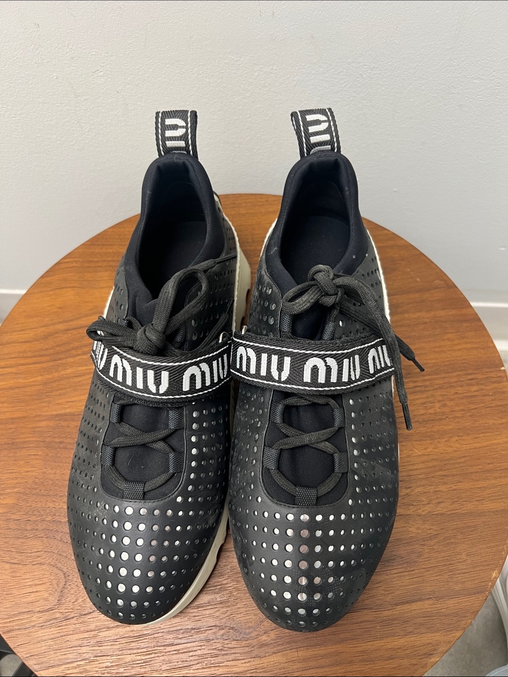 Miu Miu Black Perforated Logo-Strap Platform Sneaker with White Sole